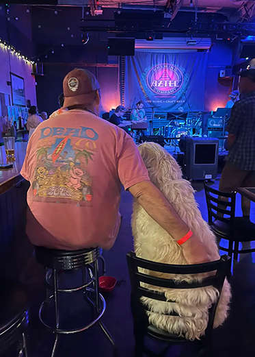 Just a dude & his dog enjoying the show at Aztec